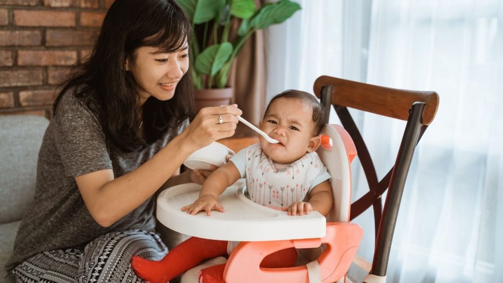 adult feeding child